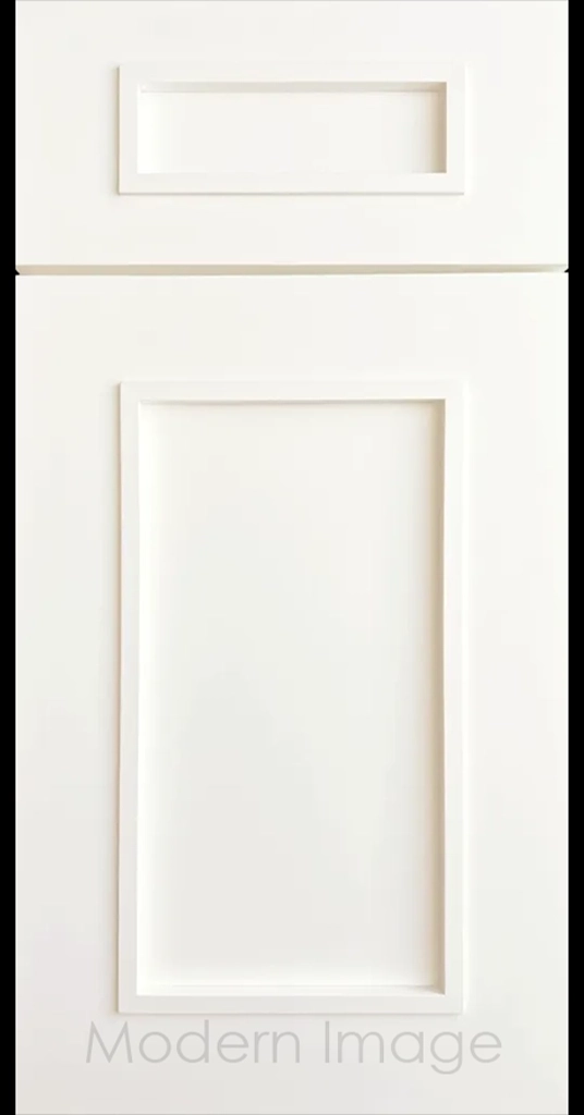 Gilbert cabinet a recessed flat panel and elevated molding in Frost White color.